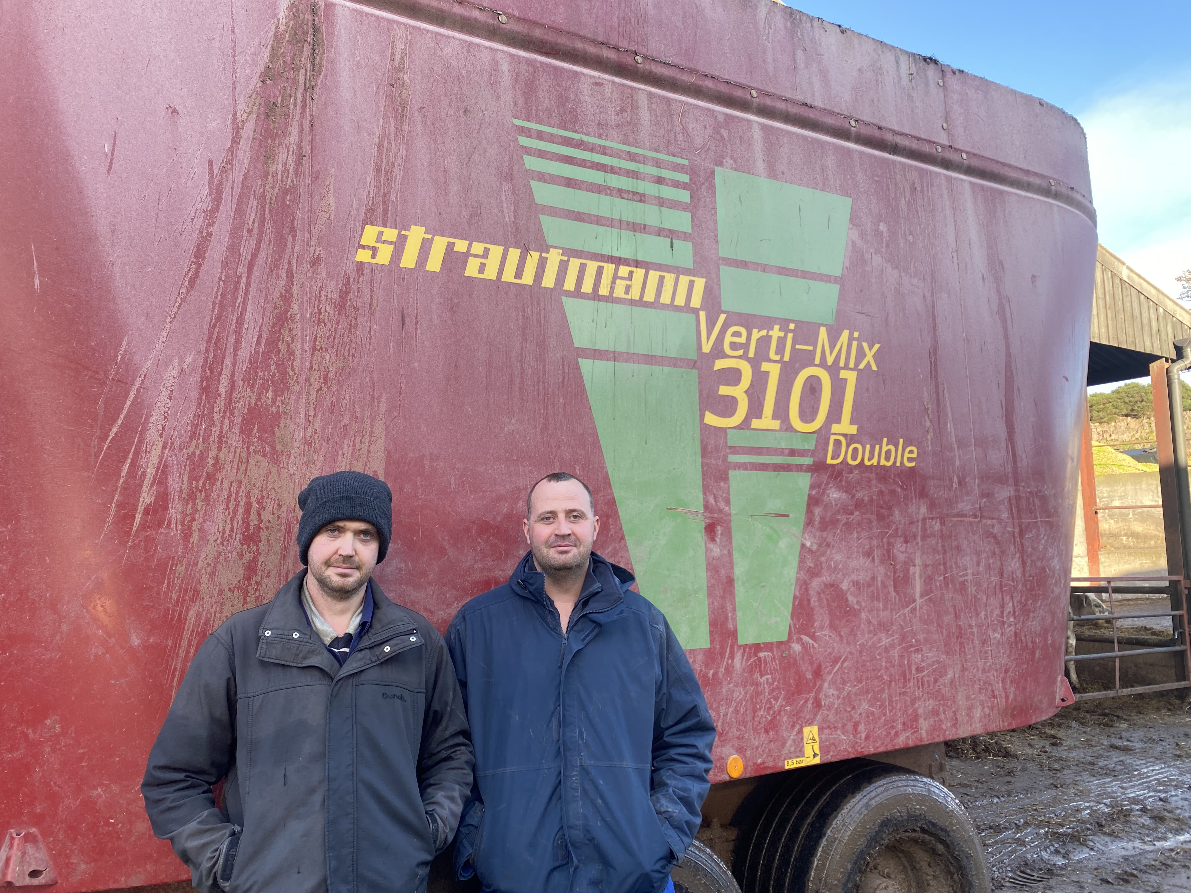 Steve and Andrew Davies of Lawn Farm, Shropshire, stood next to their Strautmann Verti-Mix Expert 3101 Diet Feeder