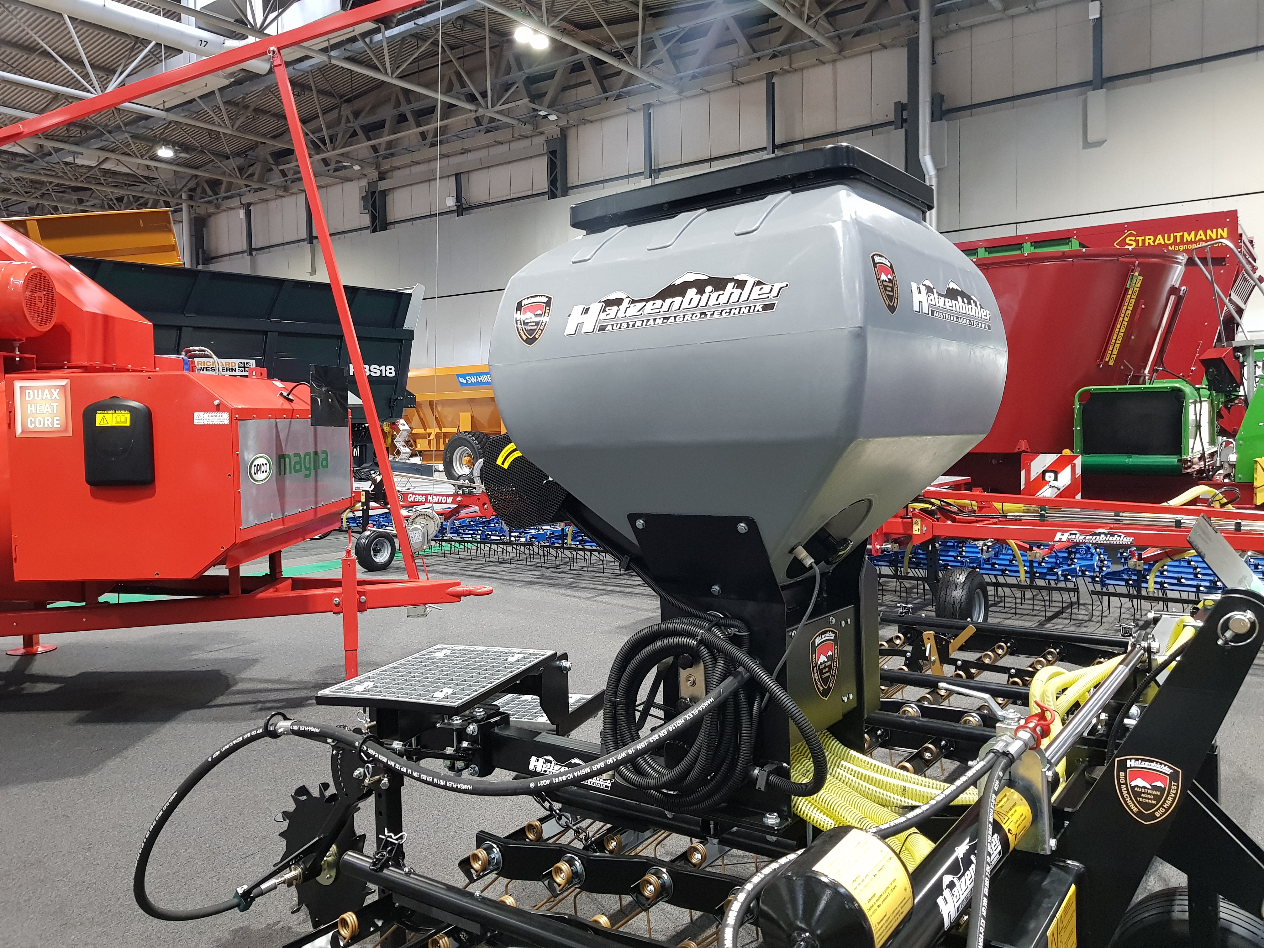 Close-up of the Air Seeder mounted to the 30th anniversary Hatzenbichler Grass Harrow, on stand at LAMMA 2025